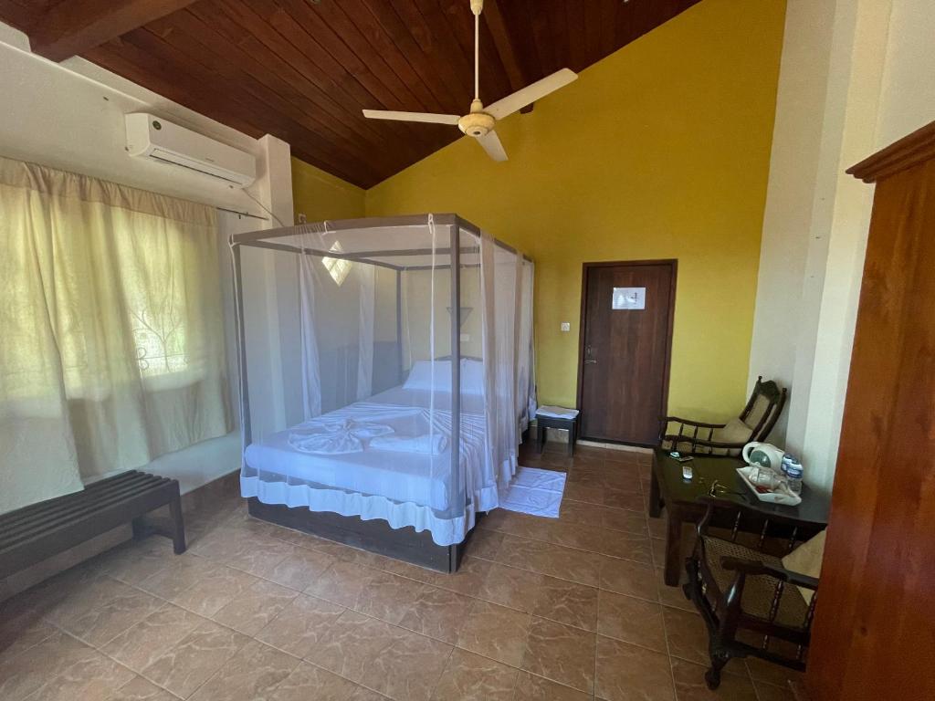 Postel nebo postele na pokoji v ubytování Una Beach Hotel & OLU Cafe