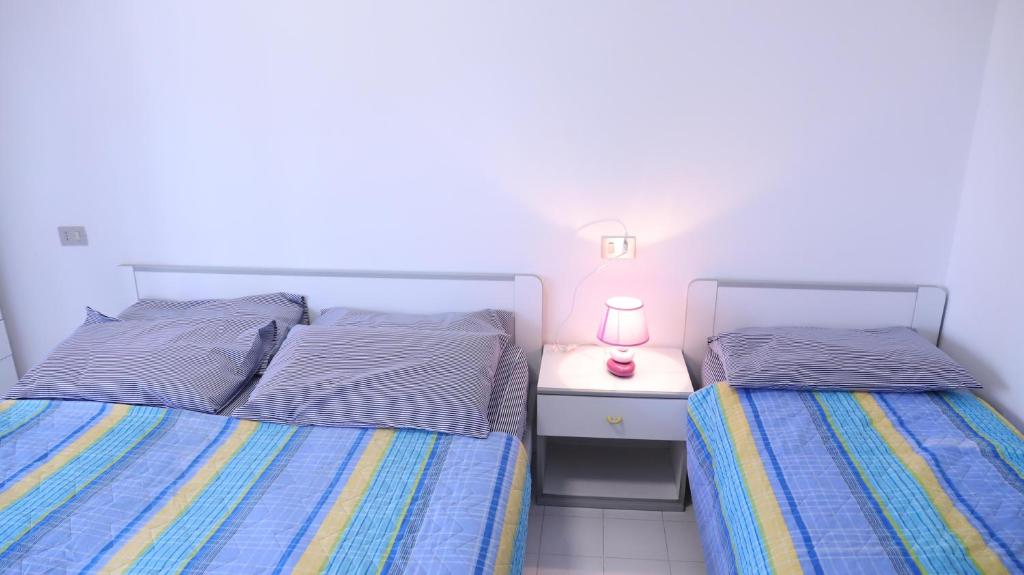 Posteľ alebo postele v izbe v ubytovaní Residence Gemini - Gemini