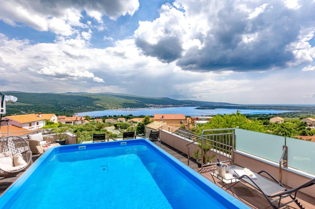 a villa with a swimming pool and a view at Villa Antonia in Kornić