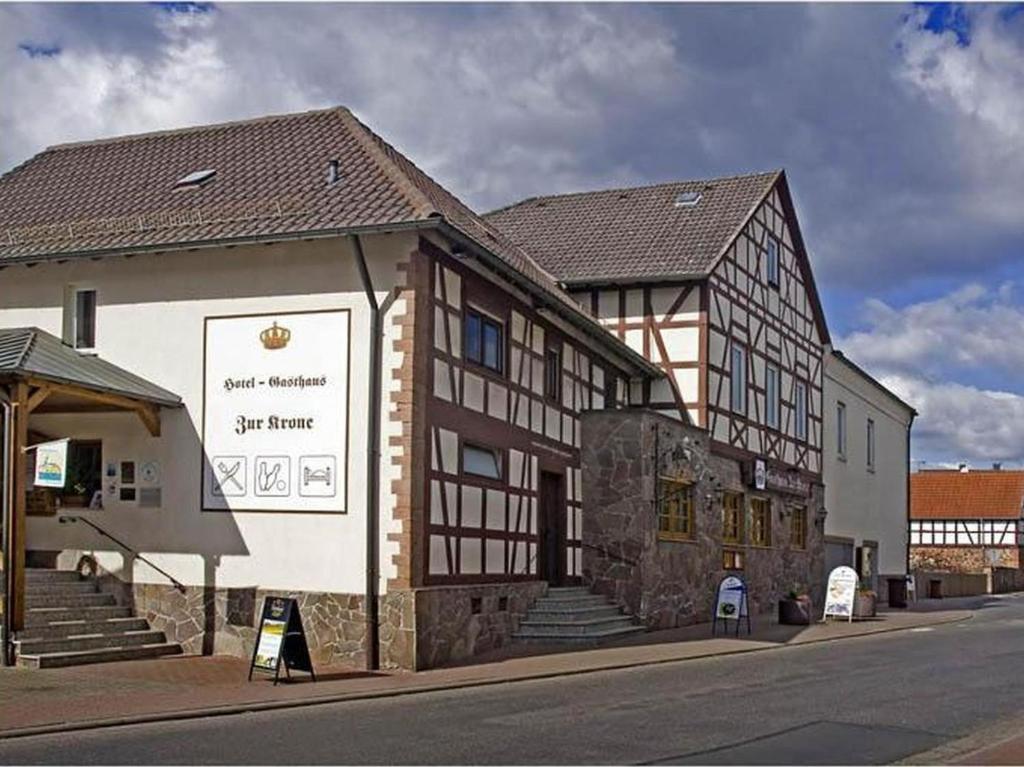 a building on the side of a street at Hotel Zur Krone in Ronneburg