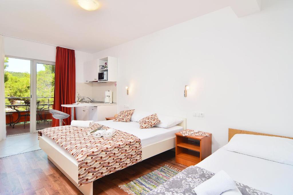 Posteľ alebo postele v izbe v ubytovaní Apartments Juka