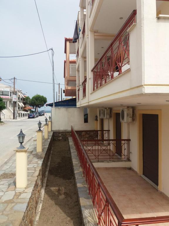 a building on the side of a street at Hotel Kosmas in Sarti