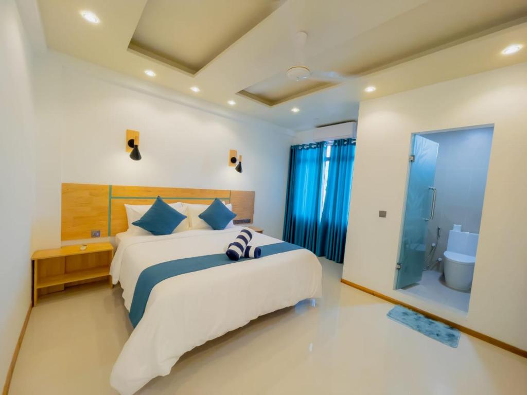 Postel nebo postele na pokoji v ubytování Wish Guesthouse