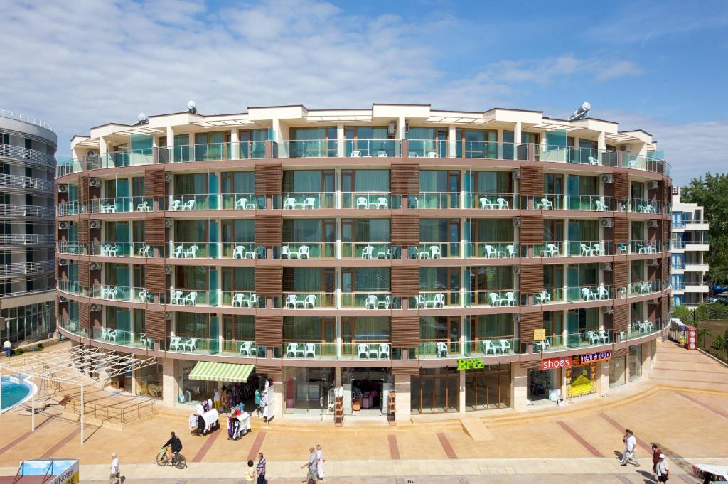 a large building with people walking in front of it at Briz - Seabreeze Hotel in Sunny Beach