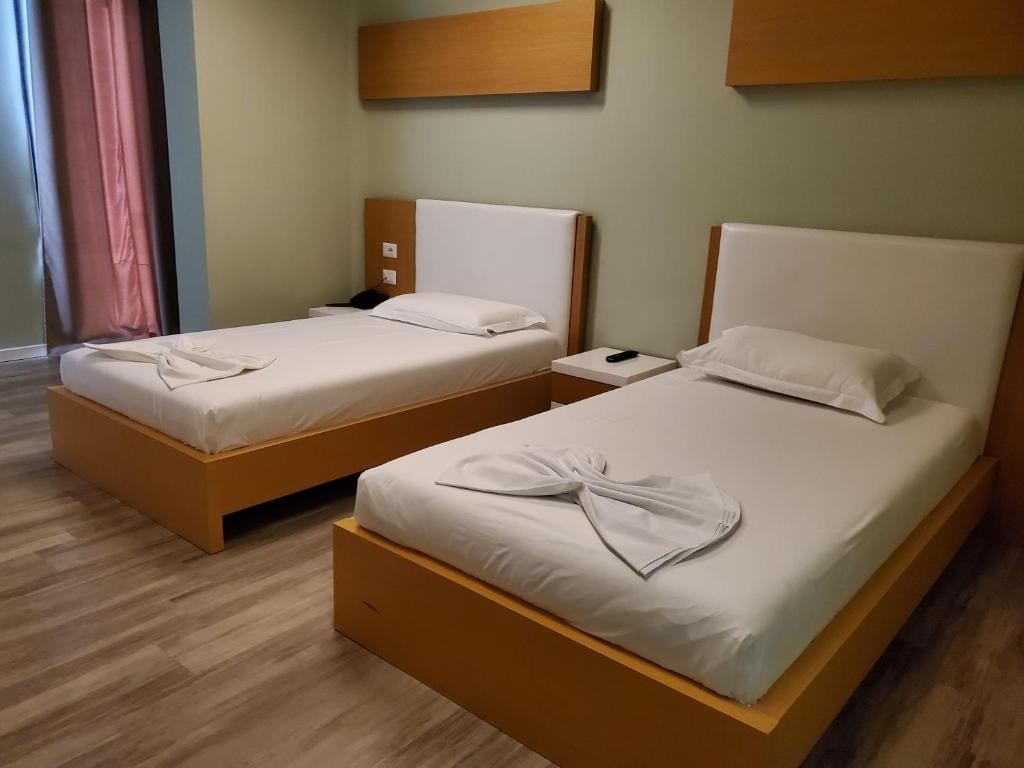 Postel nebo postele na pokoji v ubytování Hotel Bologna
