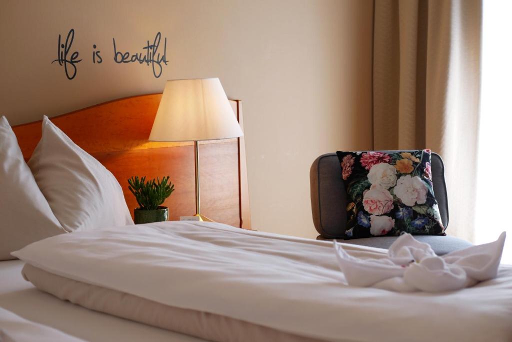 Postel nebo postele na pokoji v ubytování Hotel Stoiser Graz