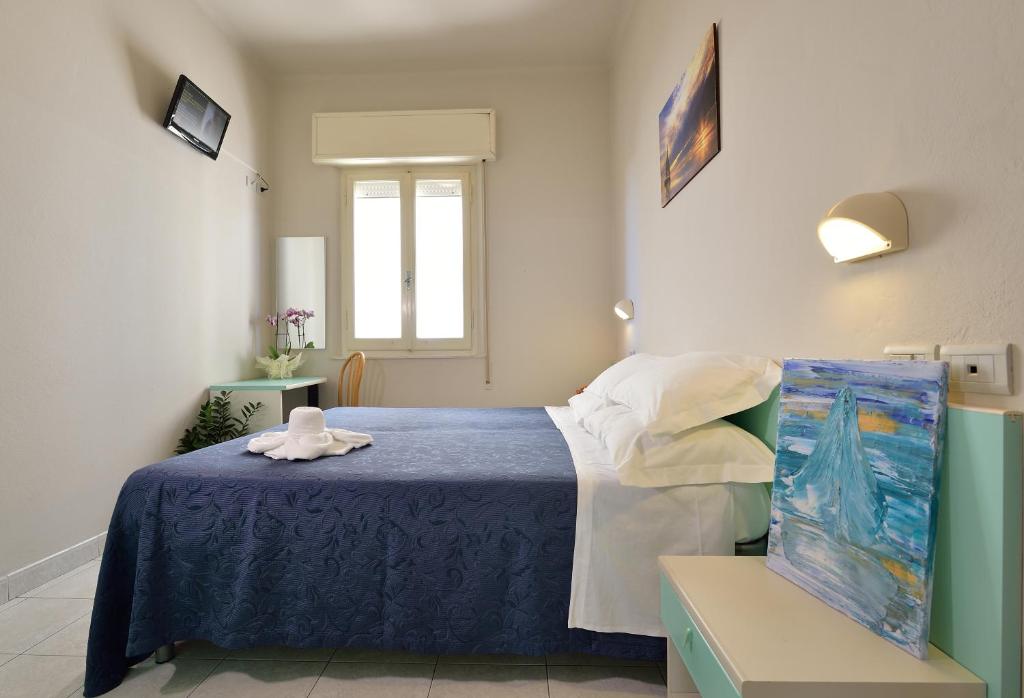 Postel nebo postele na pokoji v ubytování Hotel Oltremar B&B