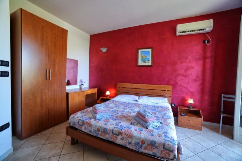 A bed or beds in a room at Maxpensione