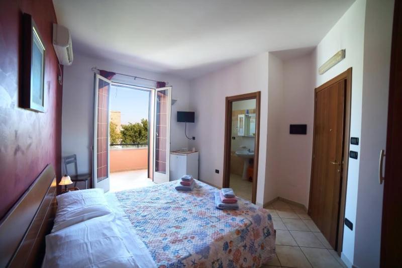 A bed or beds in a room at Maxpensione