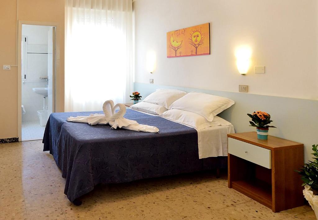 Postel nebo postele na pokoji v ubytování Hotel Oltremar B&B