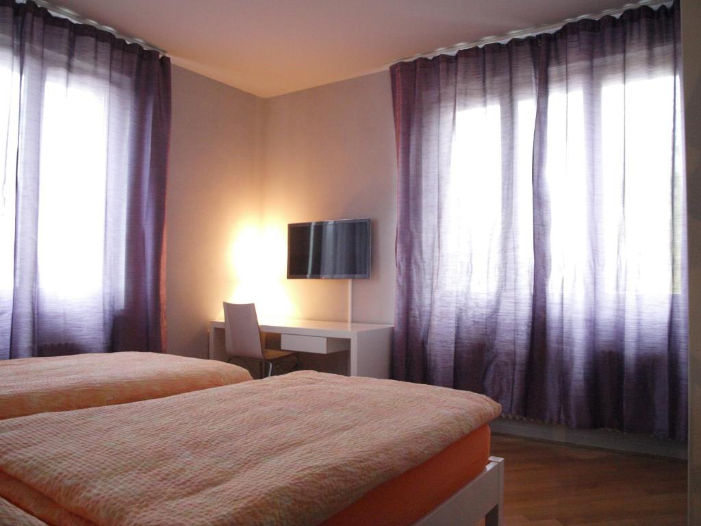 Postel nebo postele na pokoji v ubytování Auberge de Founex
