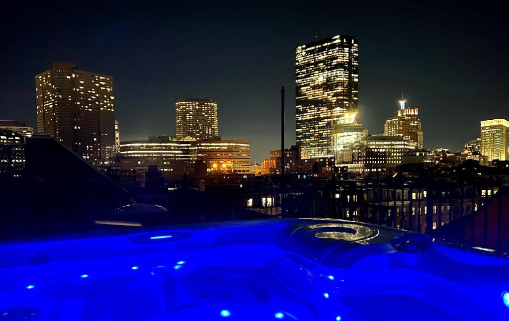 a view of a city skyline at night at Clarendon Square in Boston