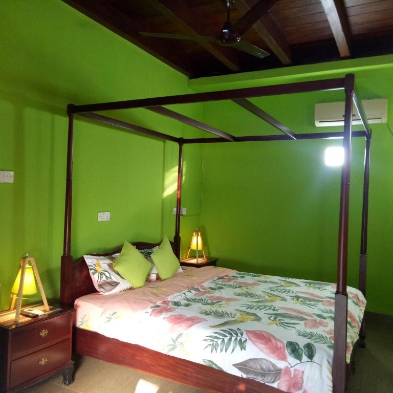Postel nebo postele na pokoji v ubytování Palms Villa