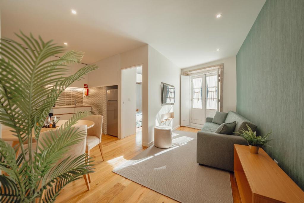 a living room with a couch and a table at River Eyes Apartments in Porto