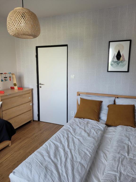 a bedroom with a bed and a white door at Apartmán Spa Šumava in Zdíkov