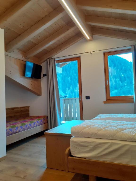 Postel nebo postele na pokoji v ubytování B&B el Benel