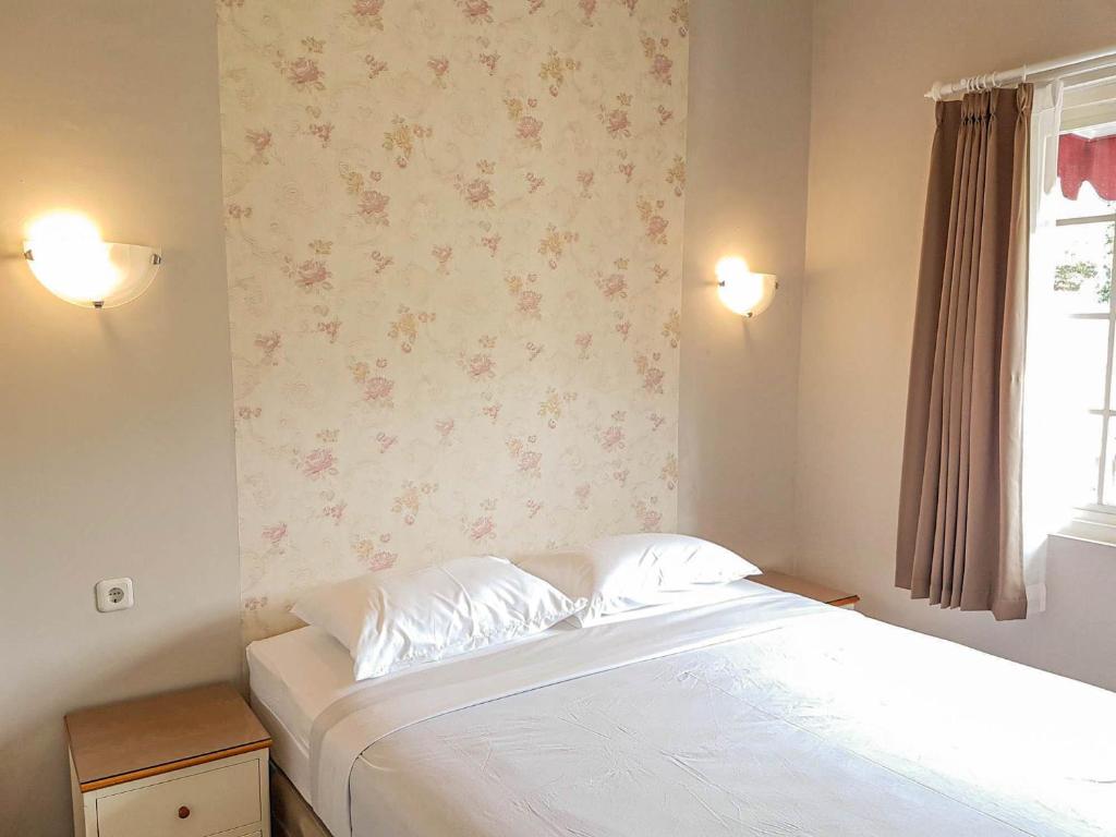 Postel nebo postele na pokoji v ubytování Rosetta Homestay