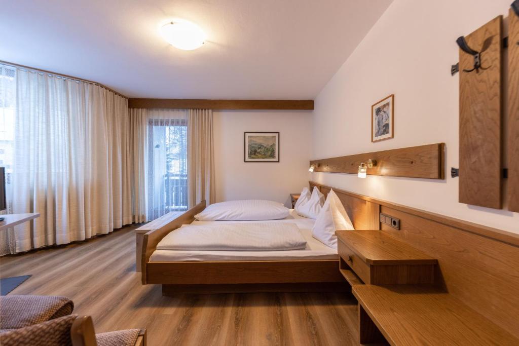 Postel nebo postele na pokoji v ubytování Hotel Fines