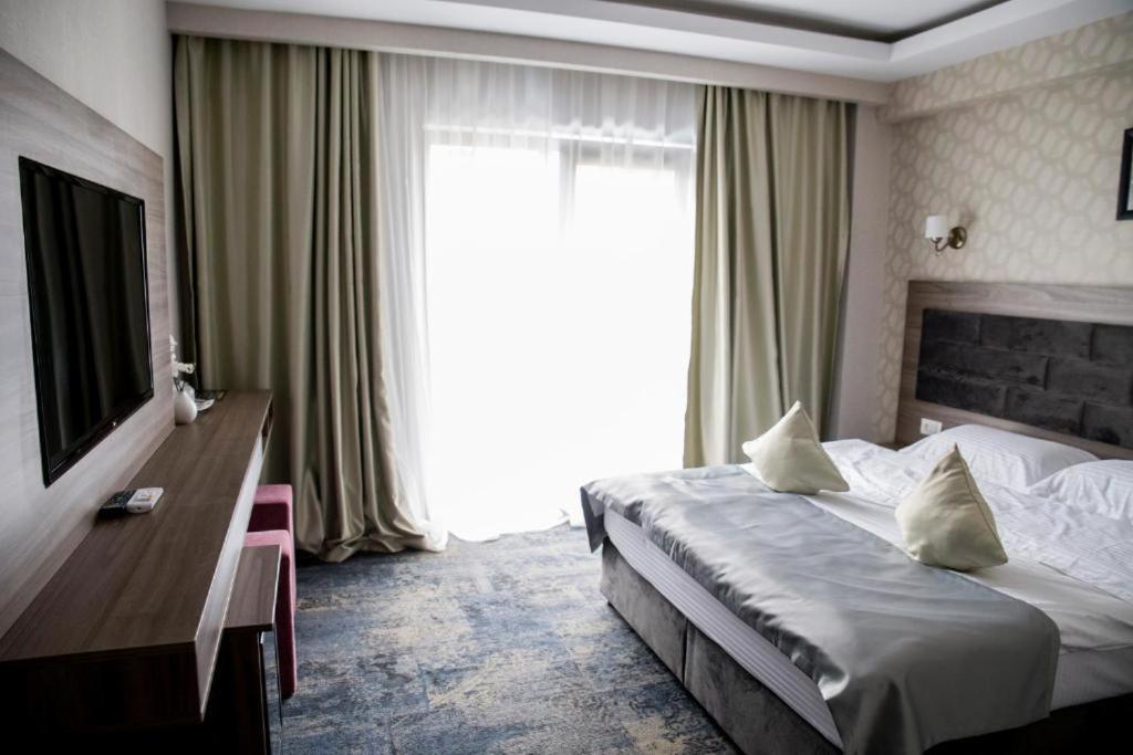 Postel nebo postele na pokoji v ubytování Hotel Yarus Plus