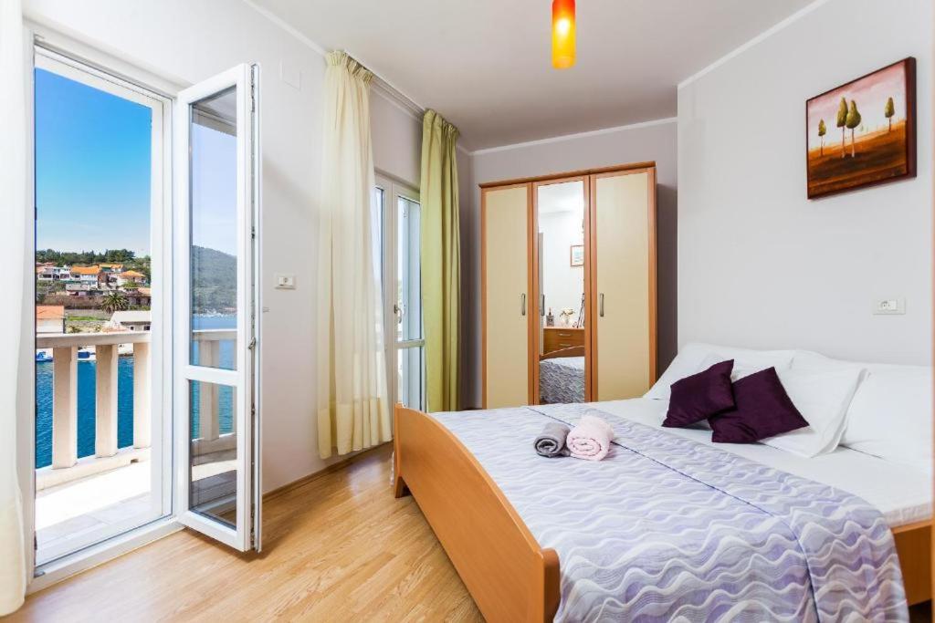 Postel nebo postele na pokoji v ubytování Apartments Dea Caeli