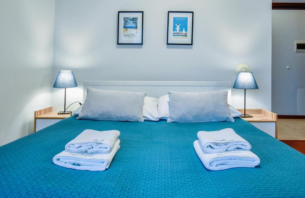 Posteľ alebo postele v izbe v ubytovaní Apartamenty na Wyspie - Baltic Park 3.0.7 - Apartament z 2 sypialniami i 80 m² tarasem