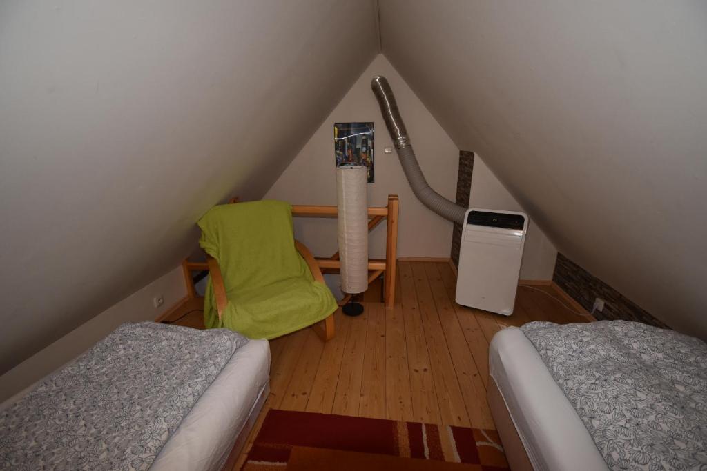 Postel nebo postele na pokoji v ubytování Apartmány Sněženka