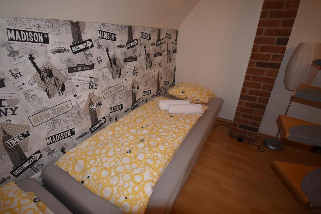 Postel nebo postele na pokoji v ubytování Apartmány Sněženka