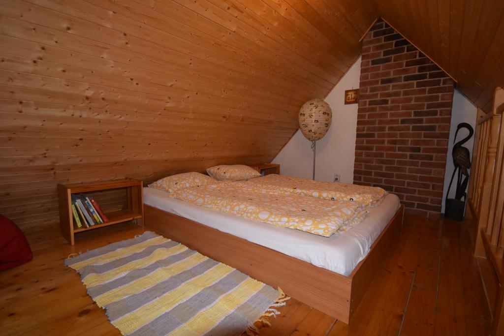 Postel nebo postele na pokoji v ubytování Apartmány Sněženka