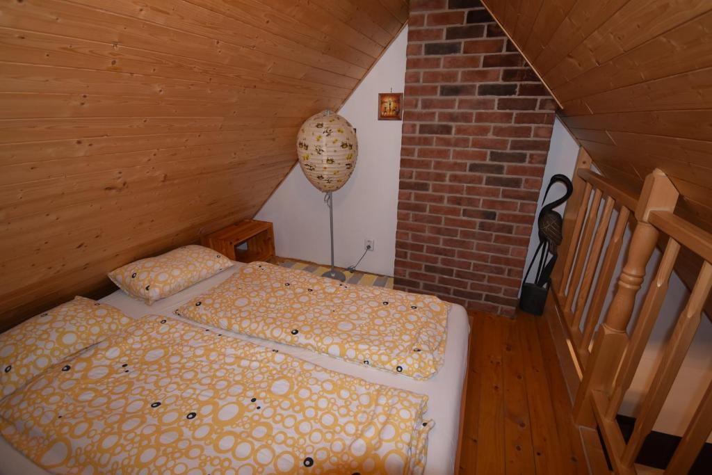 Postel nebo postele na pokoji v ubytování Apartmány Sněženka
