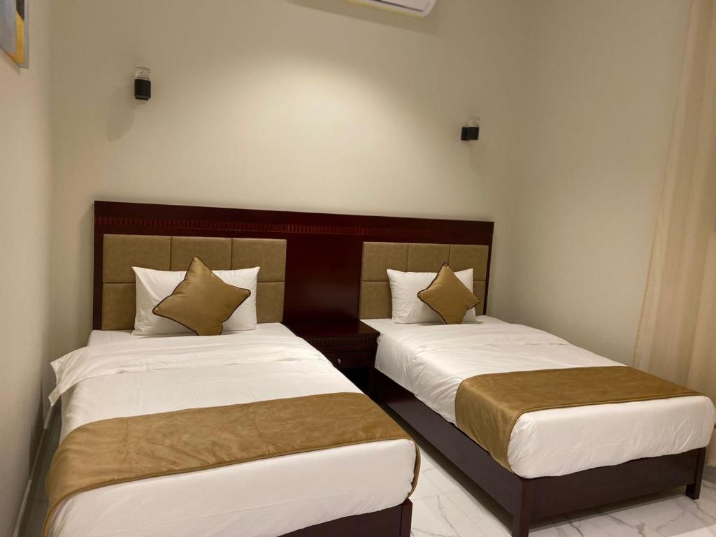 Postel nebo postele na pokoji v ubytování Qaser Sadan