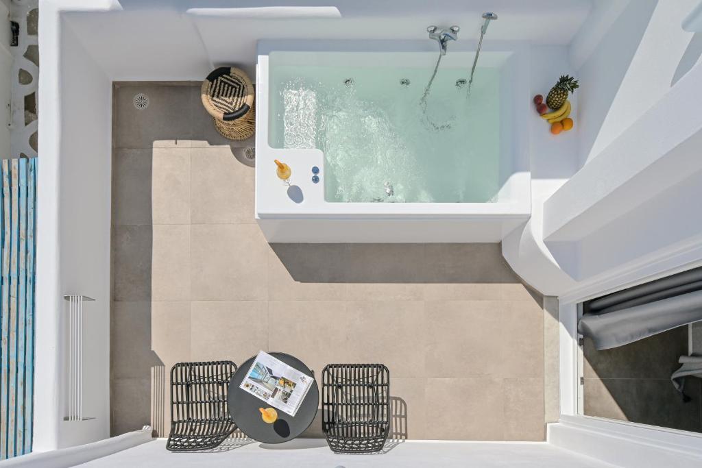 a bathroom with a swimming pool in the ceiling at Naxos Blue Sky in Naxos Chora
