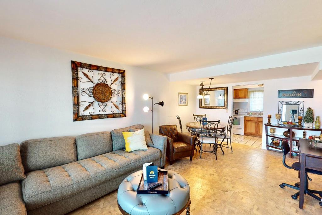 a living room with a couch and a table at Atlantico 32 in Daytona Beach