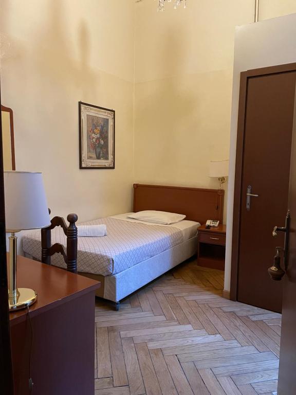 Postel nebo postele na pokoji v ubytování Hotel Antica Dogana