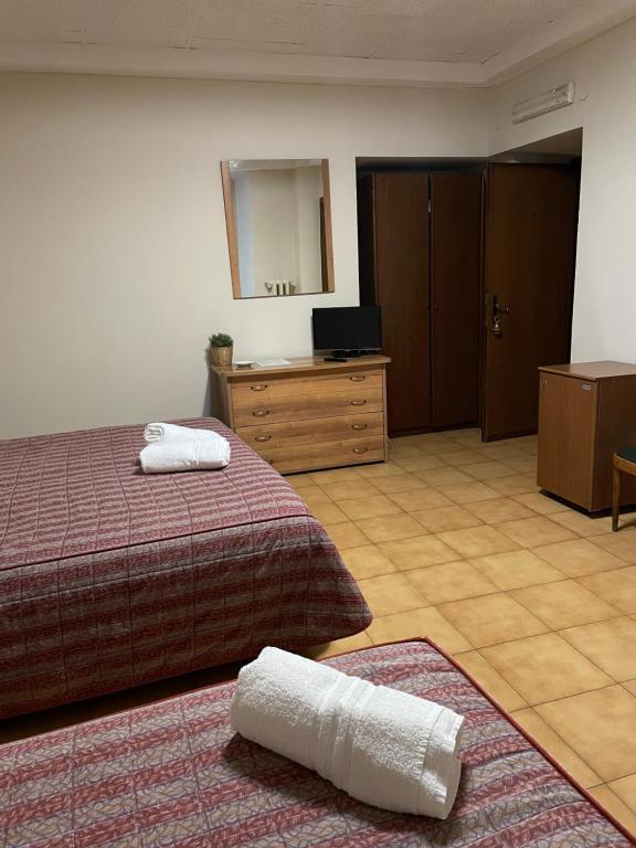 Postel nebo postele na pokoji v ubytování Hotel Antica Dogana