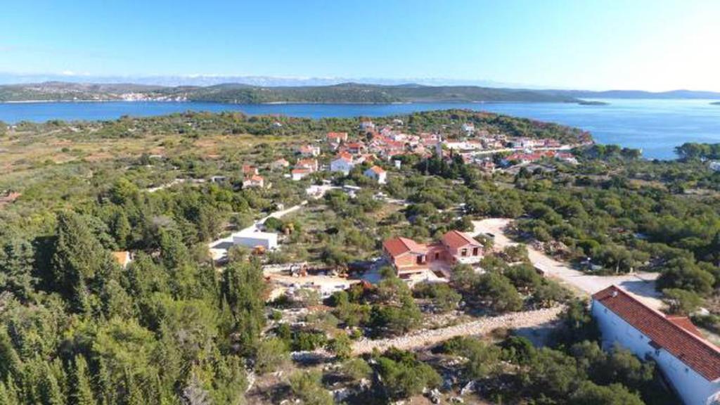 an aerial view of a small town on a lake at Apartments Irena in Božava