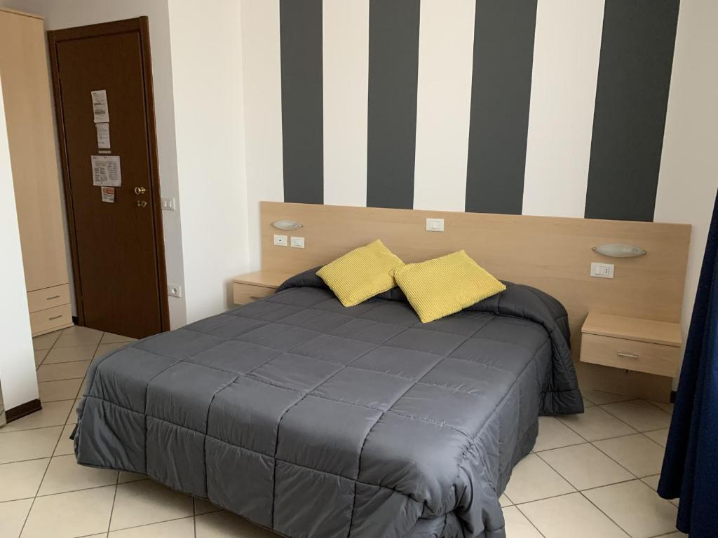 Postel nebo postele na pokoji v ubytování Hotel Bussana