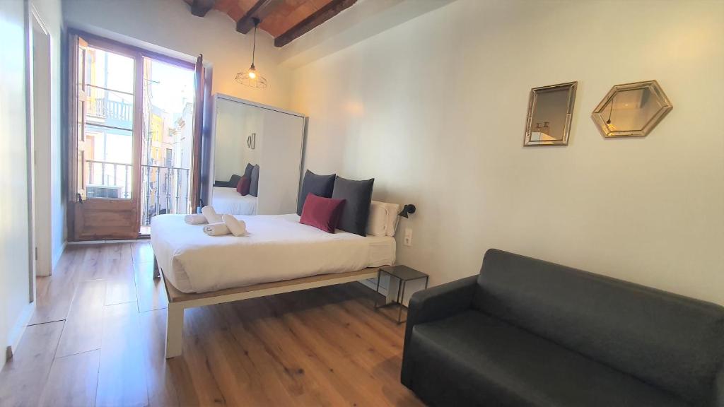 Posteľ alebo postele v izbe v ubytovaní Barrio Gotico Apartments Ferran
