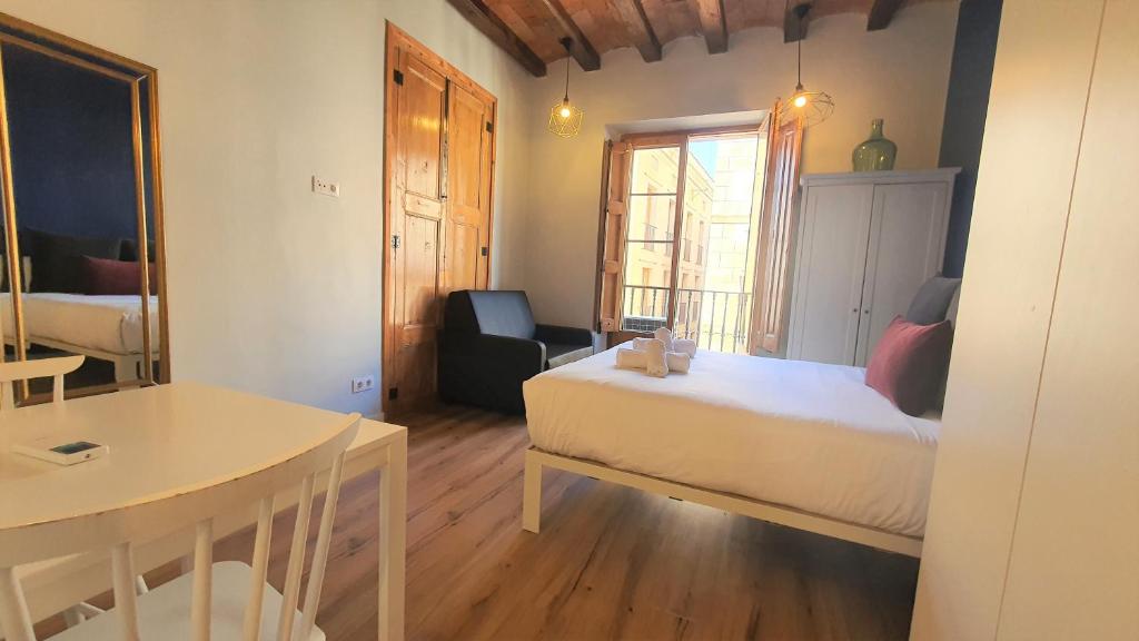 Posteľ alebo postele v izbe v ubytovaní Barrio Gotico Apartments Ferran