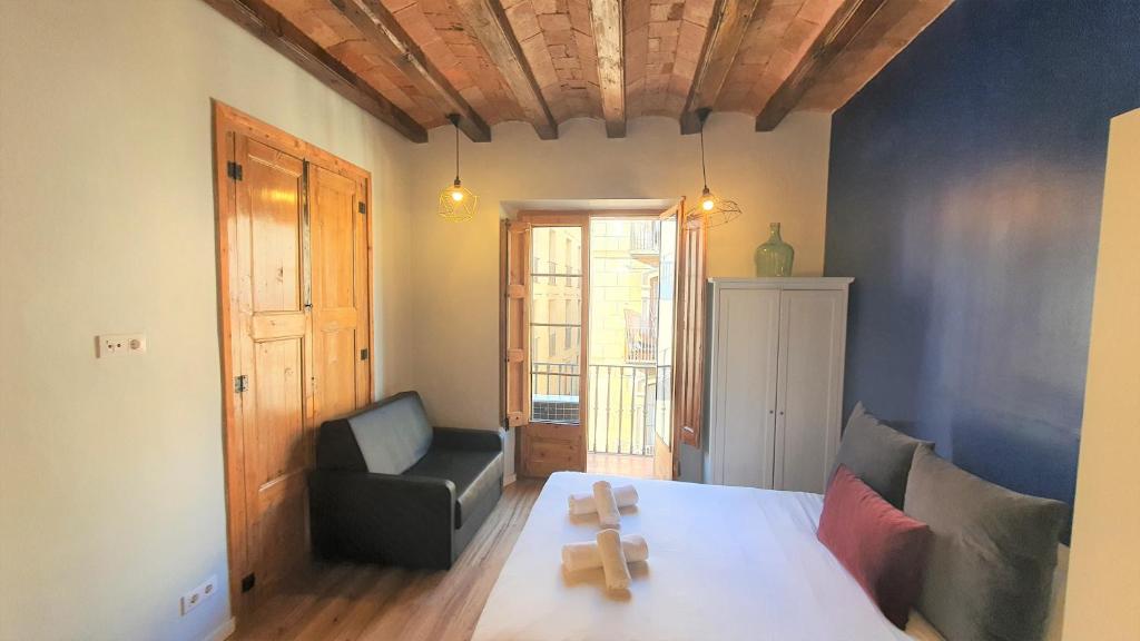 Posteľ alebo postele v izbe v ubytovaní Barrio Gotico Apartments Ferran