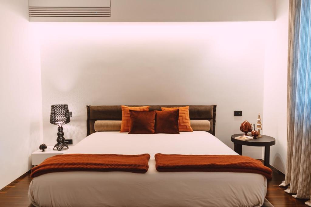 A bed or beds in a room at Viale dei Lecci - Luxury rooms