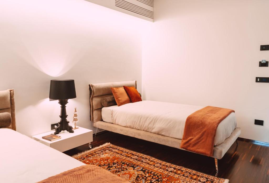 A bed or beds in a room at Viale dei Lecci - Luxury rooms