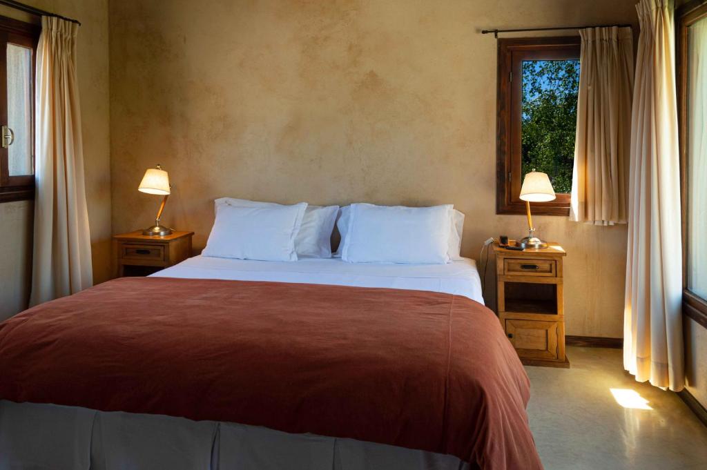 Postel nebo postele na pokoji v ubytování Aldebaran Hotel & Spa