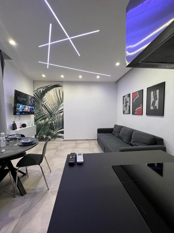 a living room with a couch and a table at The Jungle Home in Naples