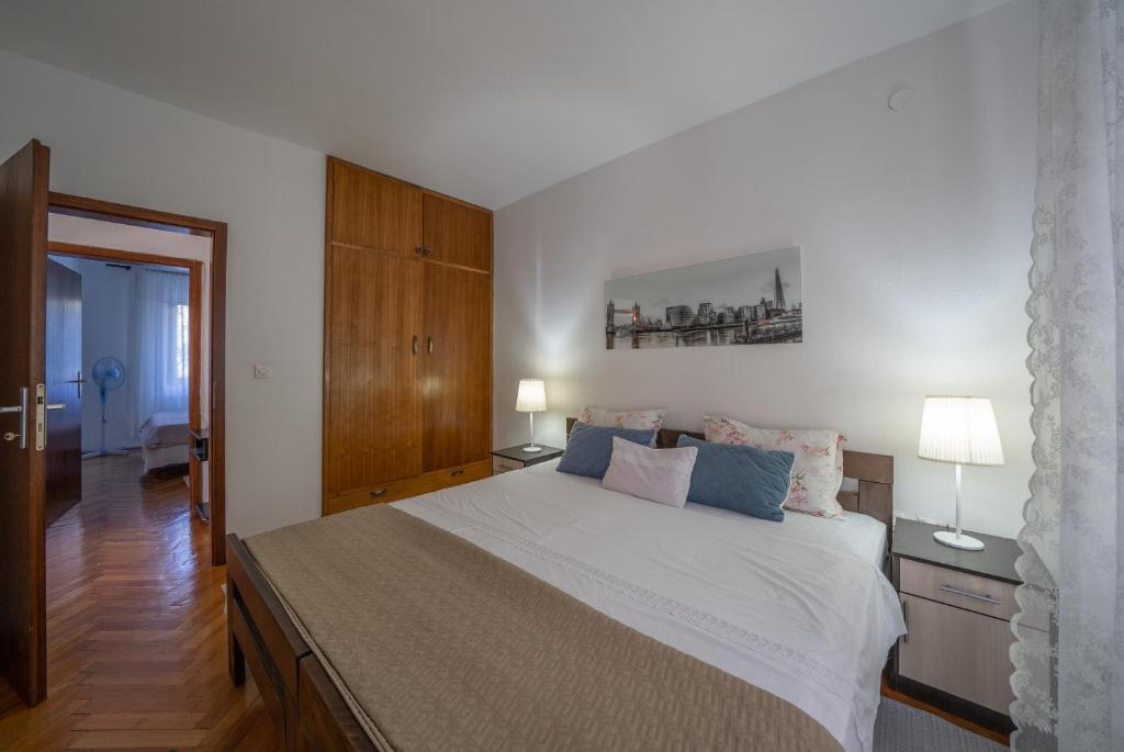 Postel nebo postele na pokoji v ubytování Aneta Apartments