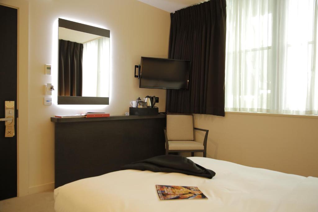 Postel nebo postele na pokoji v ubytování Hotel Xanadu