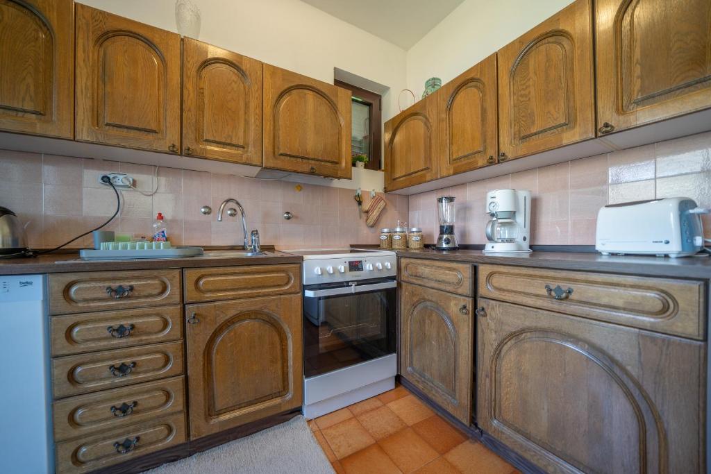 Kuchyň nebo kuchyňský kout v ubytování Aneta Apartments