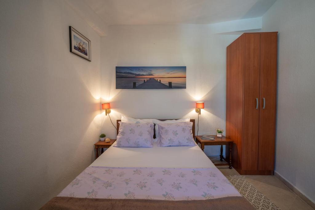 Postel nebo postele na pokoji v ubytování Aneta Apartments