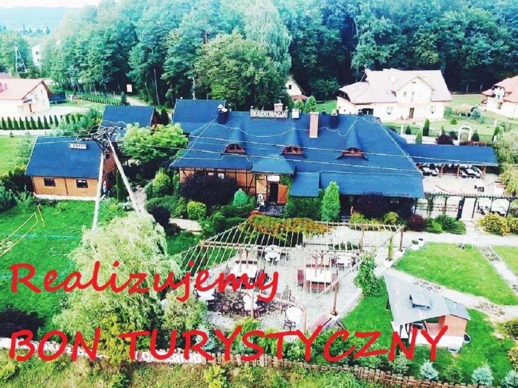 an aerial view of a house with a blue roof at Chata Starych Znajomych in Sanok