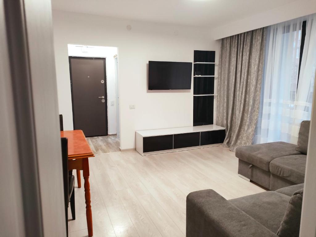 Ein Sitzbereich in der Unterkunft Apartament Lupeni/Straja