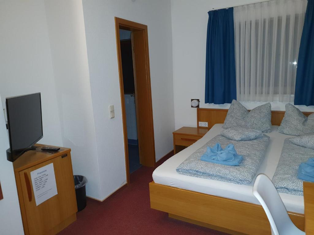 Postel nebo postele na pokoji v ubytování Mainstern Hotel